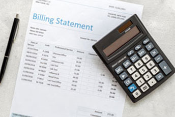 Personal Injury Claim Billing Statement with a calculator and pen - Gertler Law Firm.